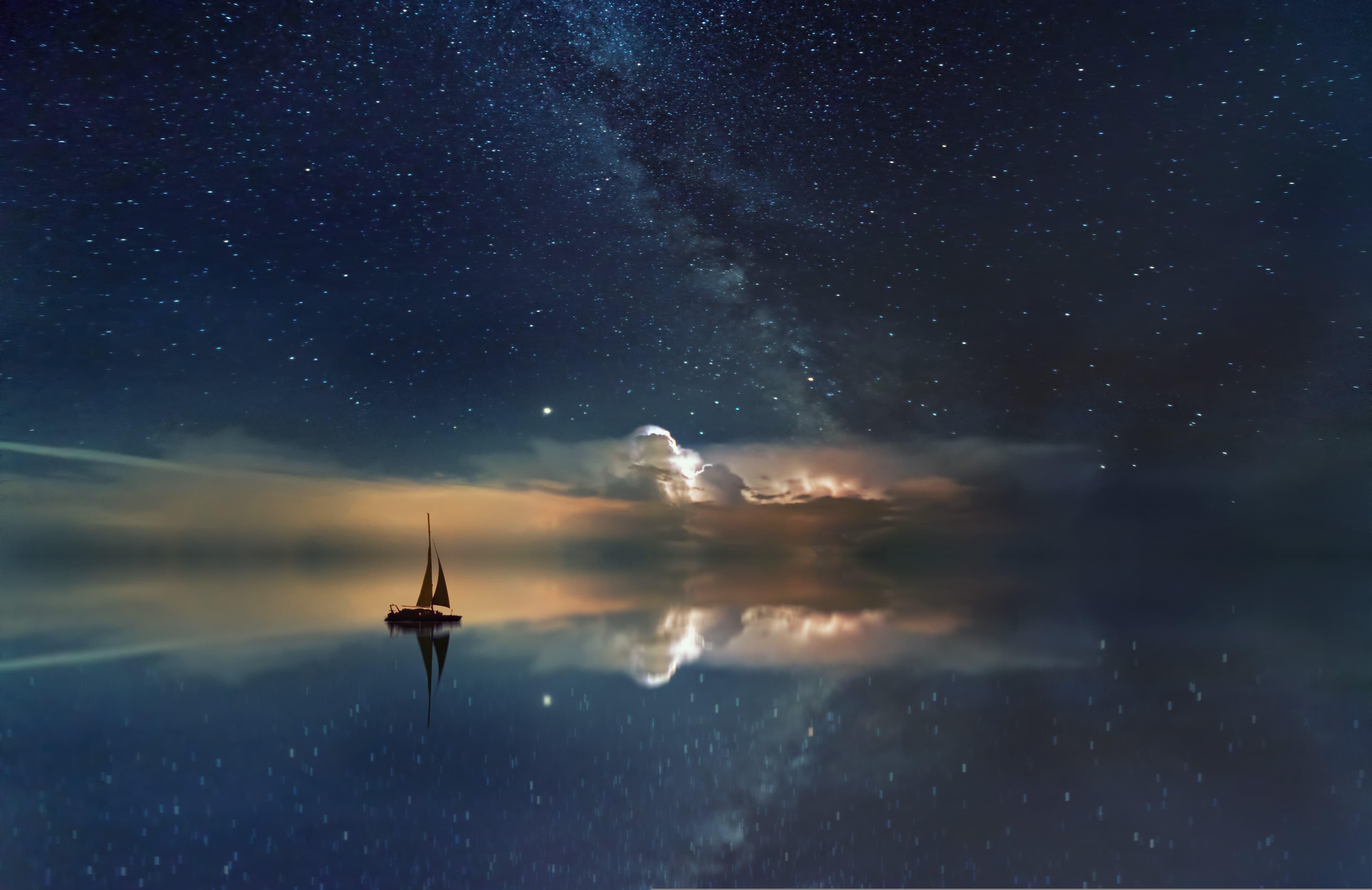 Calm mountain lake reflecting the morning sky